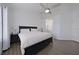 Spacious main bedroom with king-size bed and ensuite bathroom access at 5469 Fair Oaks Street St # 5C, Bradenton, FL 34203