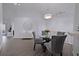 Bright dining area with glass table and grey chairs at 5469 Fair Oaks Street St # 5C, Bradenton, FL 34203