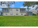 Two-story condo building with private balconies and a well-maintained lawn at 5469 Fair Oaks Street St # 5C, Bradenton, FL 34203
