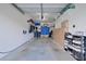 Garage with overhead storage, shelving and space for cars at 5469 Fair Oaks Street St # 5C, Bradenton, FL 34203