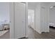 Clean hallway with doors to bedrooms and bathroom, wood floors at 5469 Fair Oaks Street St # 5C, Bradenton, FL 34203