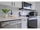 Modern kitchen with stainless steel appliances and white cabinets at 5469 Fair Oaks Street St # 5C, Bradenton, FL 34203