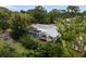 Aerial view showcasing house, pool, and lush greenery at 5575 Beneva Woods Cir, Sarasota, FL 34233