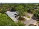 Aerial view of house and surrounding trees at 5575 Beneva Woods Cir, Sarasota, FL 34233