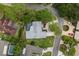 Aerial view showing house, pool, and neighborhood at 5575 Beneva Woods Cir, Sarasota, FL 34233