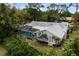 Aerial view of house, pool and backyard at 5575 Beneva Woods Cir, Sarasota, FL 34233