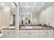 Large bathroom vanity with granite countertop and double sinks at 5575 Beneva Woods Cir, Sarasota, FL 34233