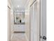 White bathroom with granite countertops and tiled floors at 5575 Beneva Woods Cir, Sarasota, FL 34233
