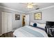 Spacious bedroom with a queen bed and access to bathroom at 5575 Beneva Woods Cir, Sarasota, FL 34233