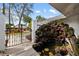 Peaceful courtyard with a pond and waterfall feature at 5575 Beneva Woods Cir, Sarasota, FL 34233