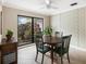 Dining area with tiled floors and patterned wall at 5575 Beneva Woods Cir, Sarasota, FL 34233
