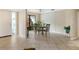 Dining area with tiled floors and a view of a garden at 5575 Beneva Woods Cir, Sarasota, FL 34233