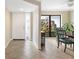 Bright entryway with tiled floors and access to dining area at 5575 Beneva Woods Cir, Sarasota, FL 34233