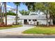 House exterior with driveway and landscaping at 5575 Beneva Woods Cir, Sarasota, FL 34233