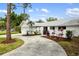 Curved driveway and landscaping leading to the house at 5575 Beneva Woods Cir, Sarasota, FL 34233