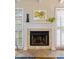 Clean-lined fireplace with a modern mantel in living room at 5575 Beneva Woods Cir, Sarasota, FL 34233