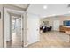 Bright hallway with view of living room and access to other rooms at 5575 Beneva Woods Cir, Sarasota, FL 34233