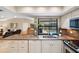 Kitchen features granite countertops and pool view at 5575 Beneva Woods Cir, Sarasota, FL 34233