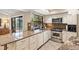 Eat-in kitchen with granite countertops and stainless steel appliances at 5575 Beneva Woods Cir, Sarasota, FL 34233
