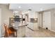 Kitchen with breakfast bar and granite countertops at 5575 Beneva Woods Cir, Sarasota, FL 34233