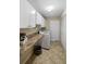 Laundry room with washer, dryer, and built-in cabinets at 5575 Beneva Woods Cir, Sarasota, FL 34233
