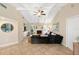 Spacious living room with vaulted ceilings, fireplace, and built-in shelving at 5575 Beneva Woods Cir, Sarasota, FL 34233
