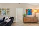 Living room with dark couch and wood cabinet at 5575 Beneva Woods Cir, Sarasota, FL 34233
