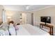 Main bedroom with king bed and en-suite bathroom at 5575 Beneva Woods Cir, Sarasota, FL 34233