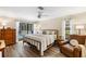 Main bedroom with king-size bed and access to the pool at 5575 Beneva Woods Cir, Sarasota, FL 34233