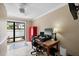 Home office with desk, computer, and view of backyard at 5575 Beneva Woods Cir, Sarasota, FL 34233