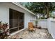 Relaxing patio with rocking chair and gravel at 5575 Beneva Woods Cir, Sarasota, FL 34233