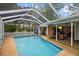 Screened-in pool with a large patio area at 5575 Beneva Woods Cir, Sarasota, FL 34233