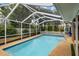 Relaxing screened-in pool area for outdoor enjoyment at 5575 Beneva Woods Cir, Sarasota, FL 34233