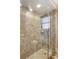 Walk-in shower with glass enclosure and tile surround at 5575 Beneva Woods Cir, Sarasota, FL 34233