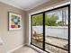Bright sunroom with view of private backyard patio and trees at 5575 Beneva Woods Cir, Sarasota, FL 34233