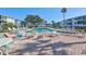 Community pool with plenty of lounge chairs at 5944 Welcome Rd # H25, Bradenton, FL 34207