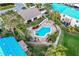 Aerial view of community pool and surrounding buildings at 6238 7Th W Ave # 6238, Bradenton, FL 34209