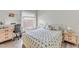 Bedroom with a queen-size bed, a desk, and wood-look floors at 6238 7Th W Ave # 6238, Bradenton, FL 34209