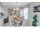 Bright dining area with white table and chairs near a window at 6238 7Th W Ave # 6238, Bradenton, FL 34209