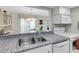 Kitchen features granite countertops and stainless steel sink at 6238 7Th W Ave # 6238, Bradenton, FL 34209