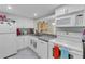 Kitchen with white cabinets, granite counters, and appliances at 6238 7Th W Ave # 6238, Bradenton, FL 34209