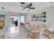 Spacious living room with comfortable seating and access to balcony at 6238 7Th W Ave # 6238, Bradenton, FL 34209