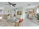 Open concept living and dining area with light flooring and furniture at 6238 7Th W Ave # 6238, Bradenton, FL 34209