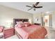 Main bedroom with king-size bed and access to bathroom at 6238 7Th W Ave # 6238, Bradenton, FL 34209