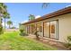 Private backyard oasis with a spacious patio and lush landscaping at 6401 Pelican Dr # 80A, Bradenton, FL 34210