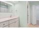 Updated bathroom with white vanity, quartz countertop, and walk-in shower at 6401 Pelican Dr # 80A, Bradenton, FL 34210