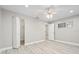Bedroom with ceiling fan, hardwood flooring, and large closet at 6401 Pelican Dr # 80A, Bradenton, FL 34210