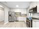 Modern kitchen with stainless steel appliances and granite countertops at 6401 Pelican Dr # 80A, Bradenton, FL 34210