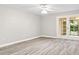 Bright living room with new flooring and access to patio at 6401 Pelican Dr # 80A, Bradenton, FL 34210