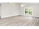 Bright living room featuring new flooring and french doors at 6401 Pelican Dr # 80A, Bradenton, FL 34210